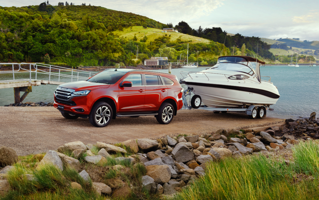 Emerging from lockdown Isuzu MU-X towing boat